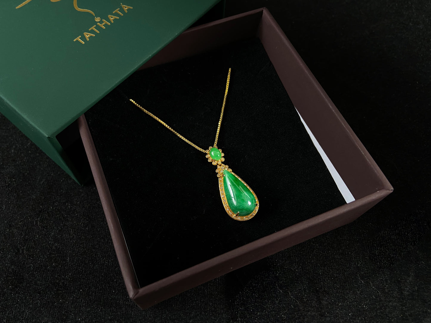 Imperial Jadeite meets sterling silver in this elegant pendant, masterfully uniting an oval and teardrop in one harmonious design.