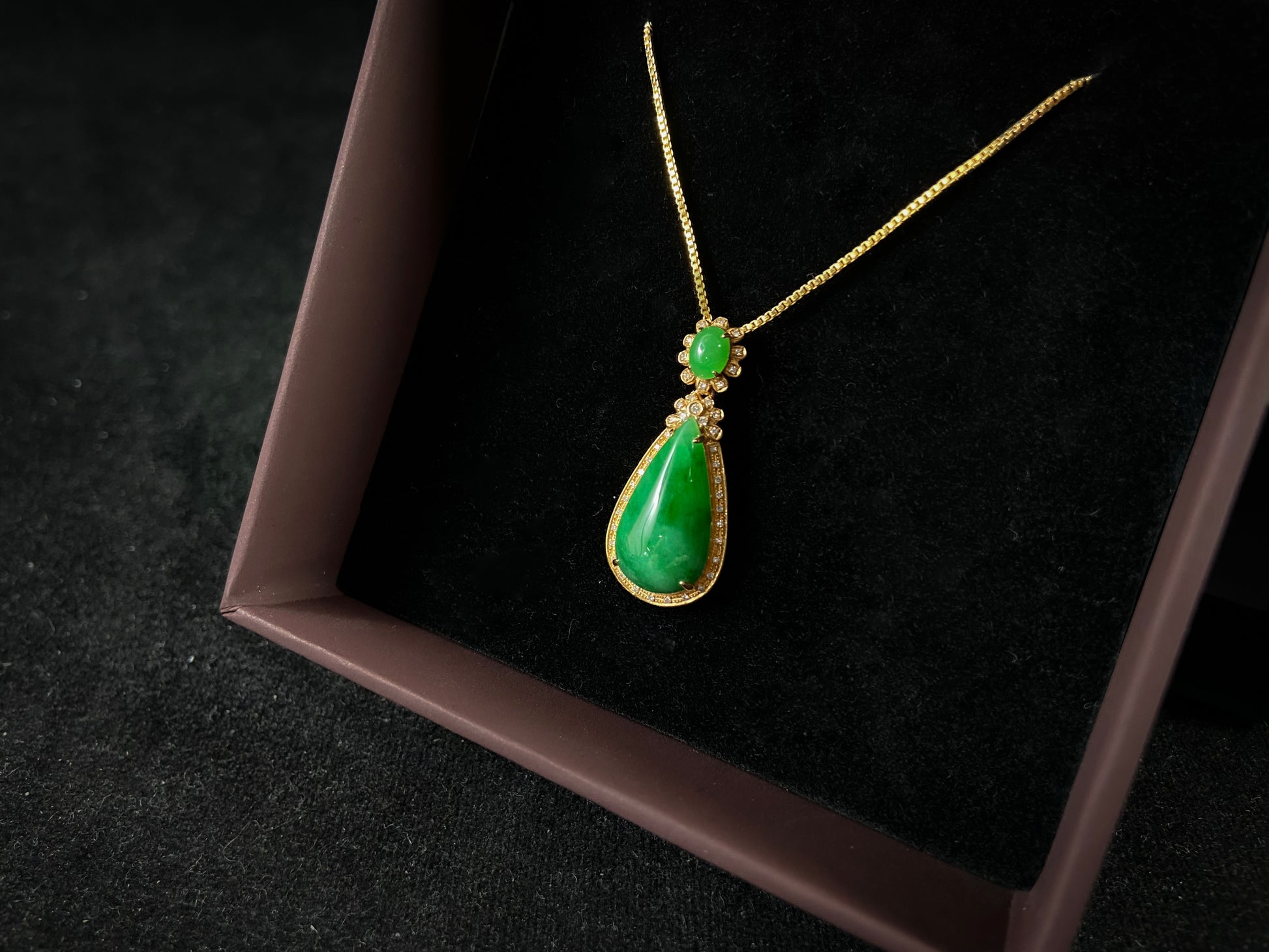 Imperial Jadeite meets sterling silver in this elegant pendant, masterfully uniting an oval and teardrop in one harmonious design.