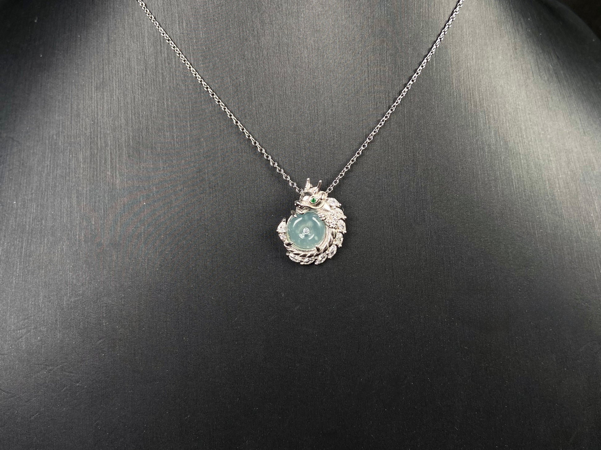 A azure dragon guard jadeite pendant.
