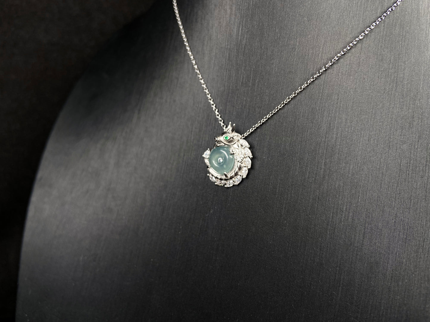 A azure dragon guard jadeite pendant.