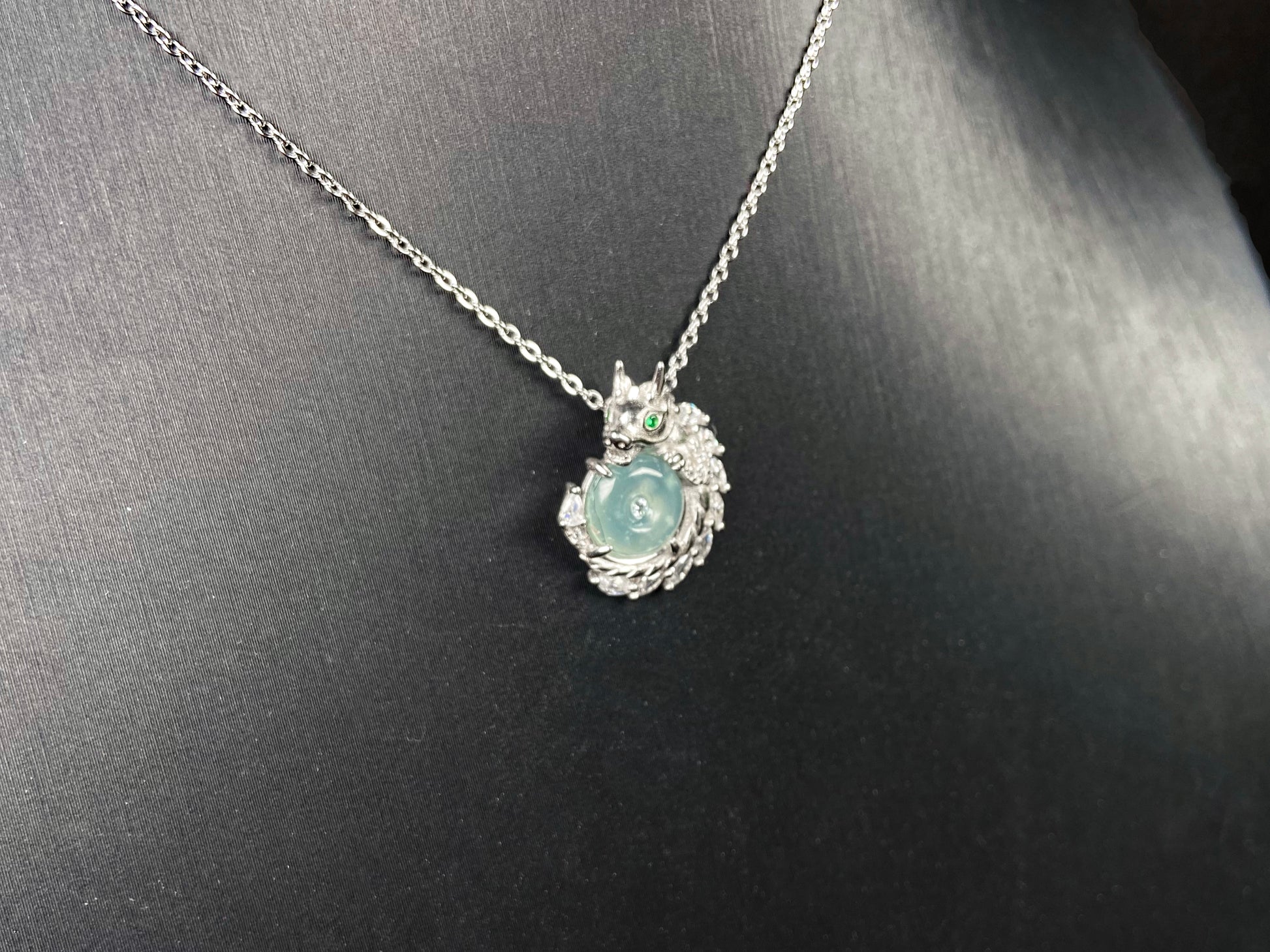 A azure dragon guard jadeite pendant.