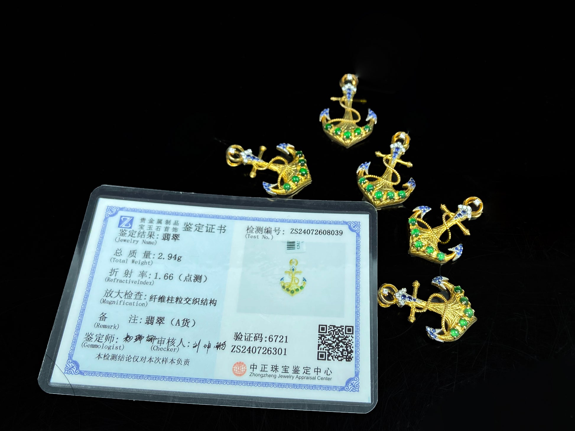 A vivid green anchor fortune jadeite pendant group.