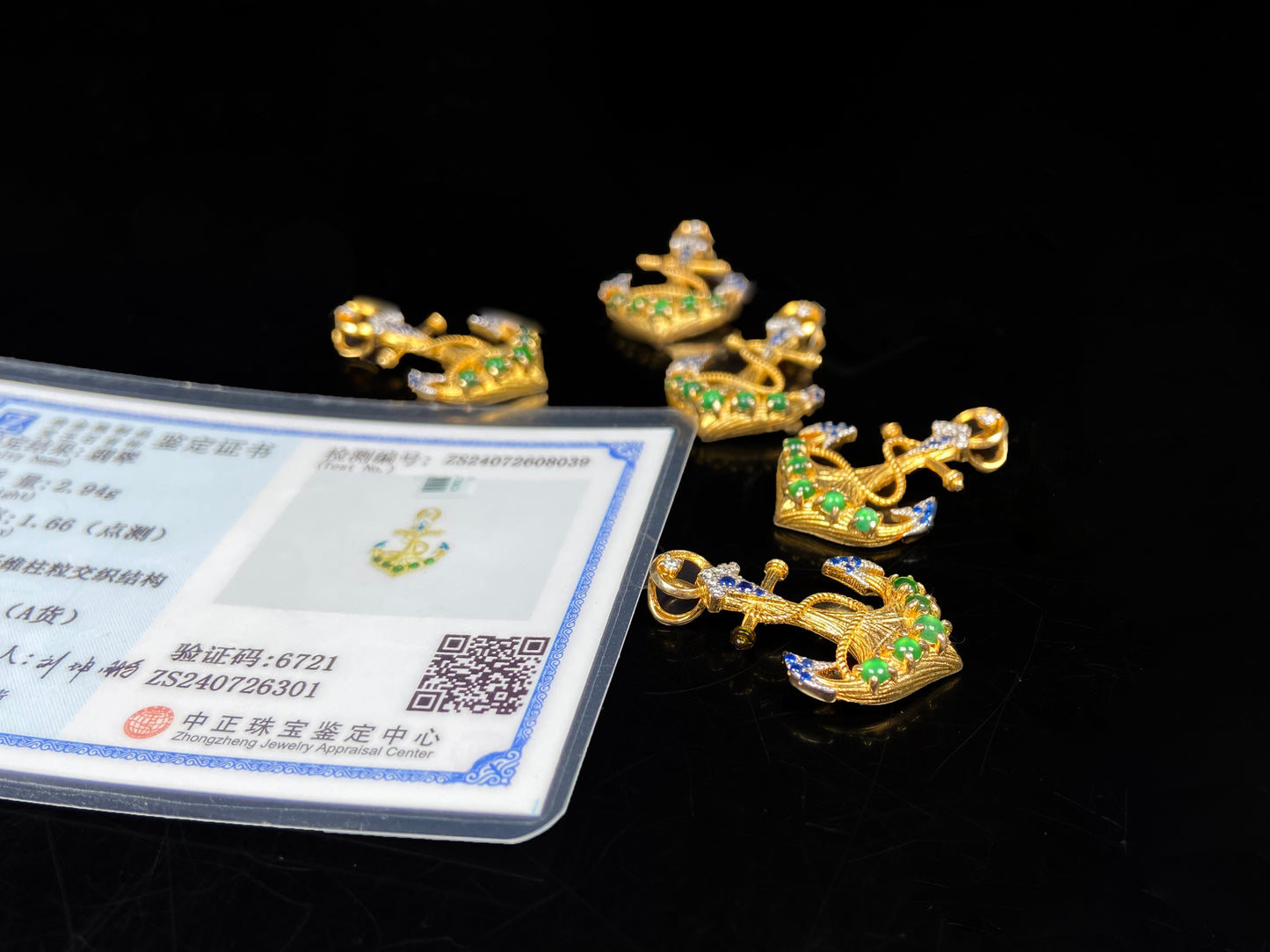 A vivid green anchor fortune jadeite pendant group.