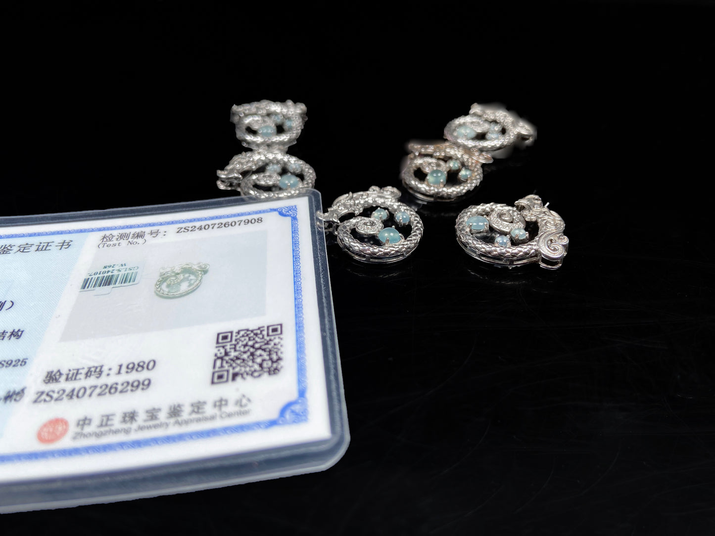 A icy blue coiled dragon jadeite pendant.