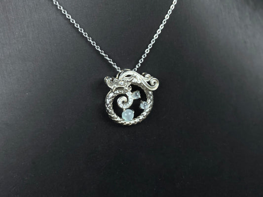 A icy blue coiled dragon jadeite pendant.
