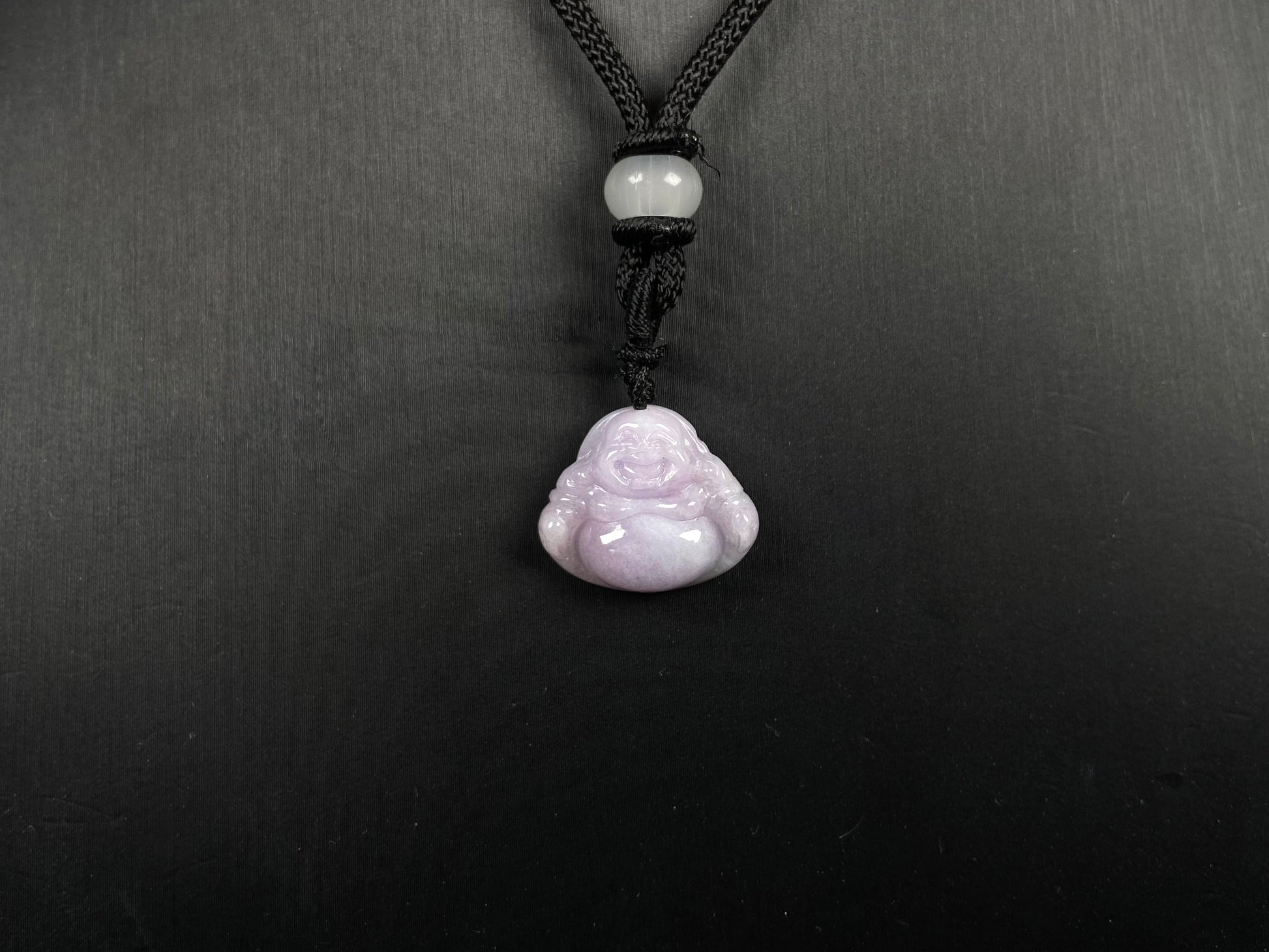 A lavender green buddha loose jadeite.