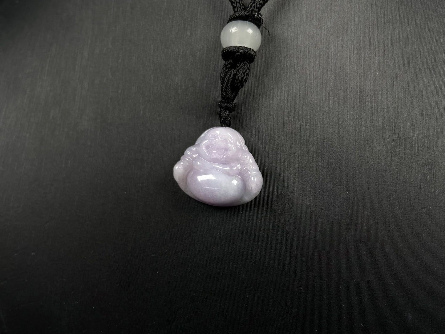 A lavender green buddha loose jadeite.