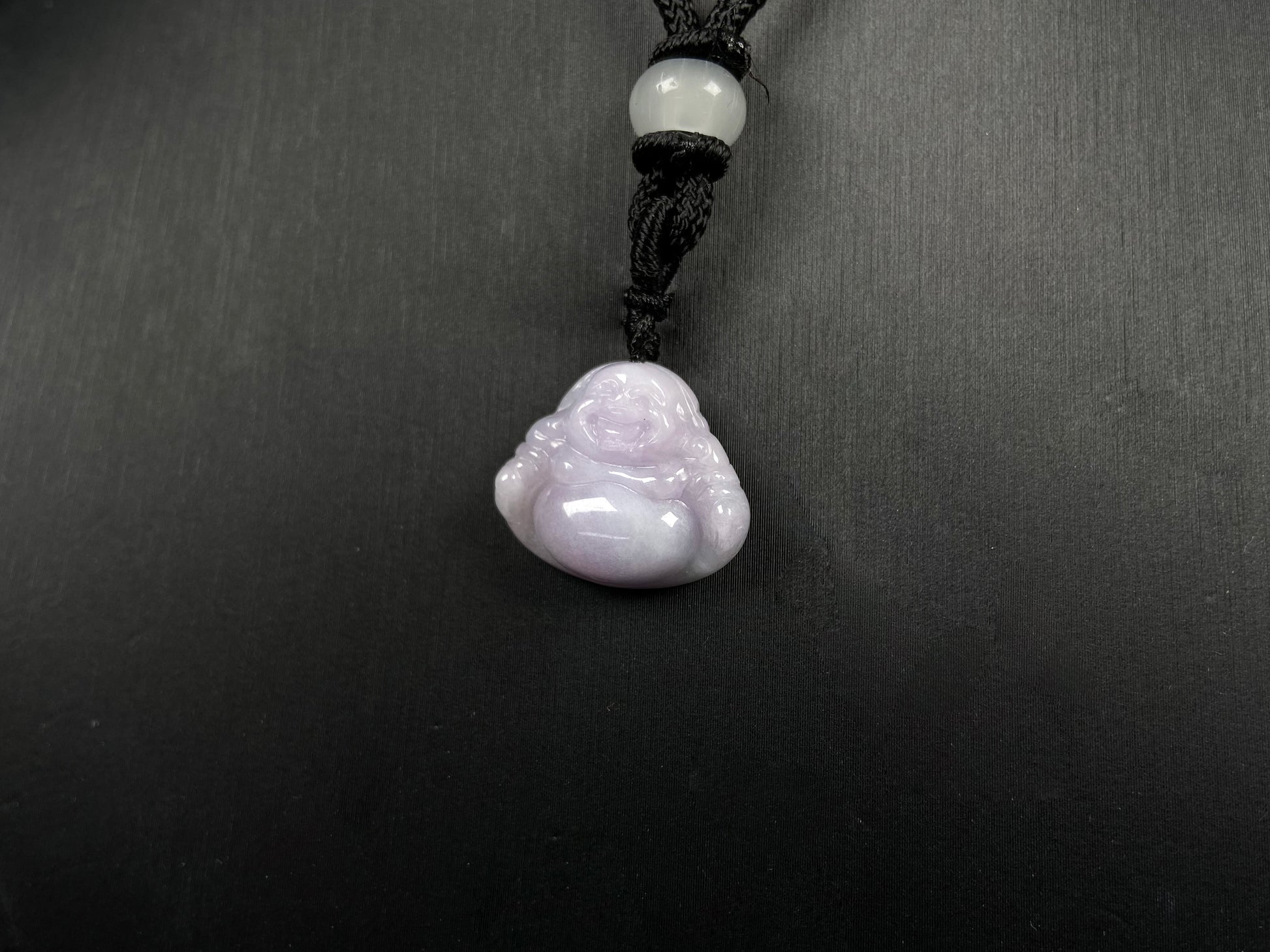 A lavender green buddha loose jadeite.