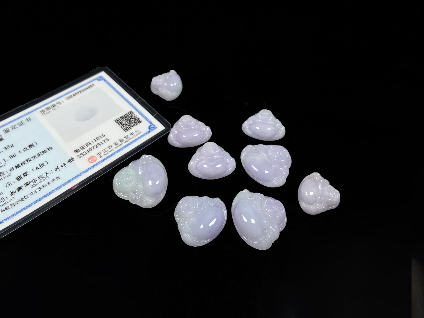 A lavender green buddha loose jadeite group.