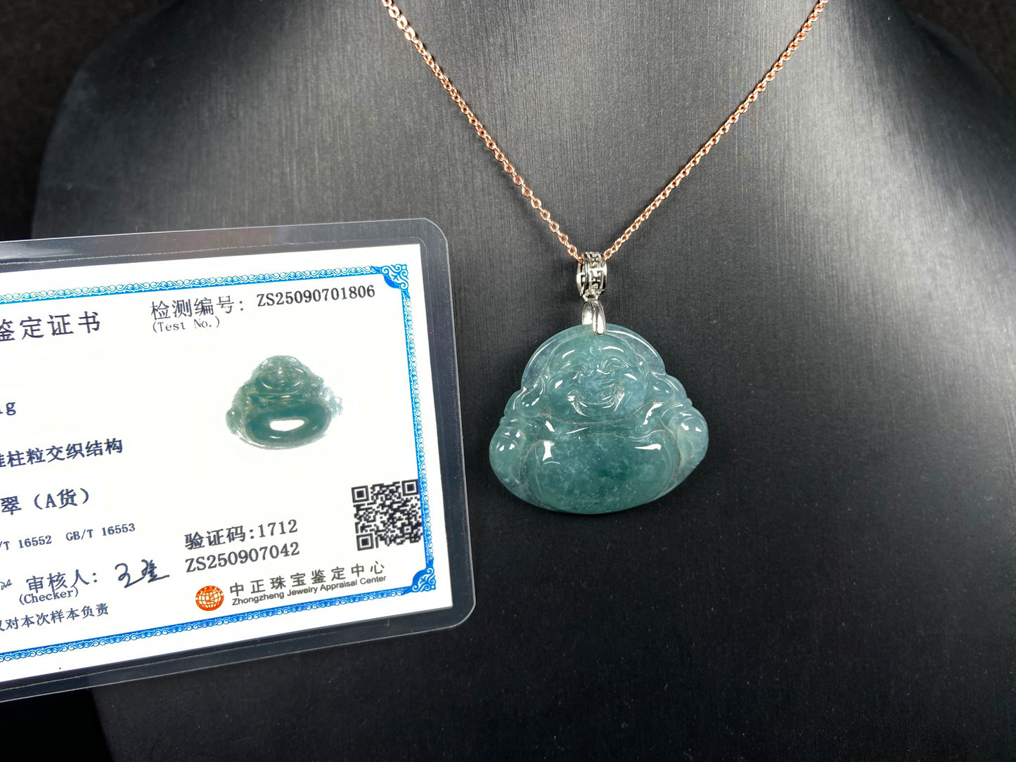 A glacial blue green Buddha jadeite pendant group.