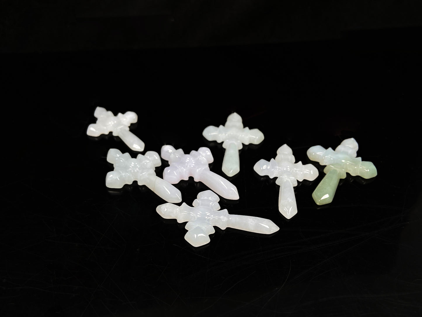 A milky white sword cross loose jadeite group.
