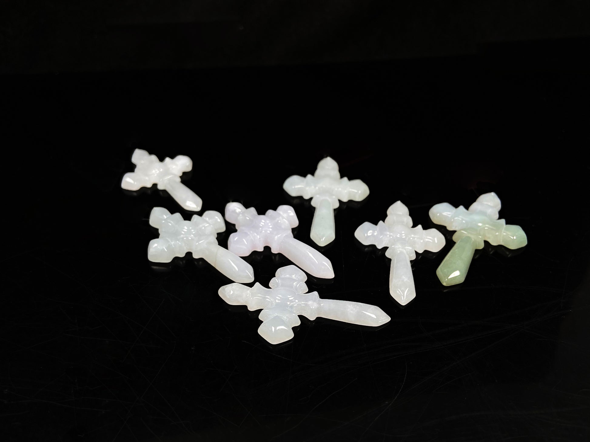 A milky white sword cross loose jadeite group.