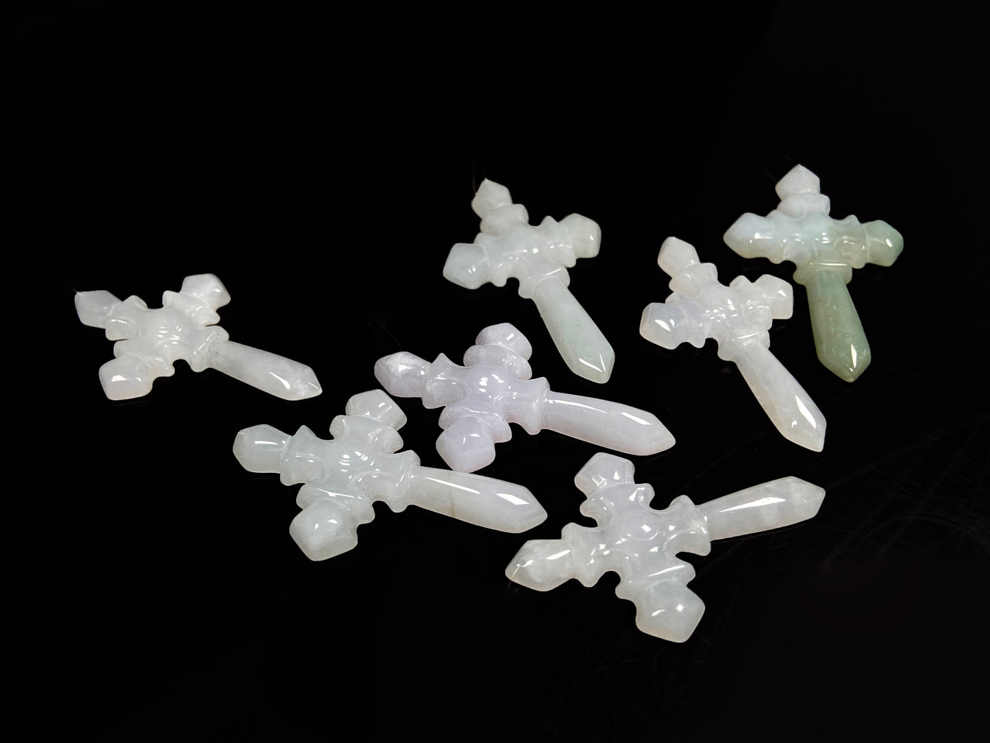 A milky white sword cross loose jadeite group.