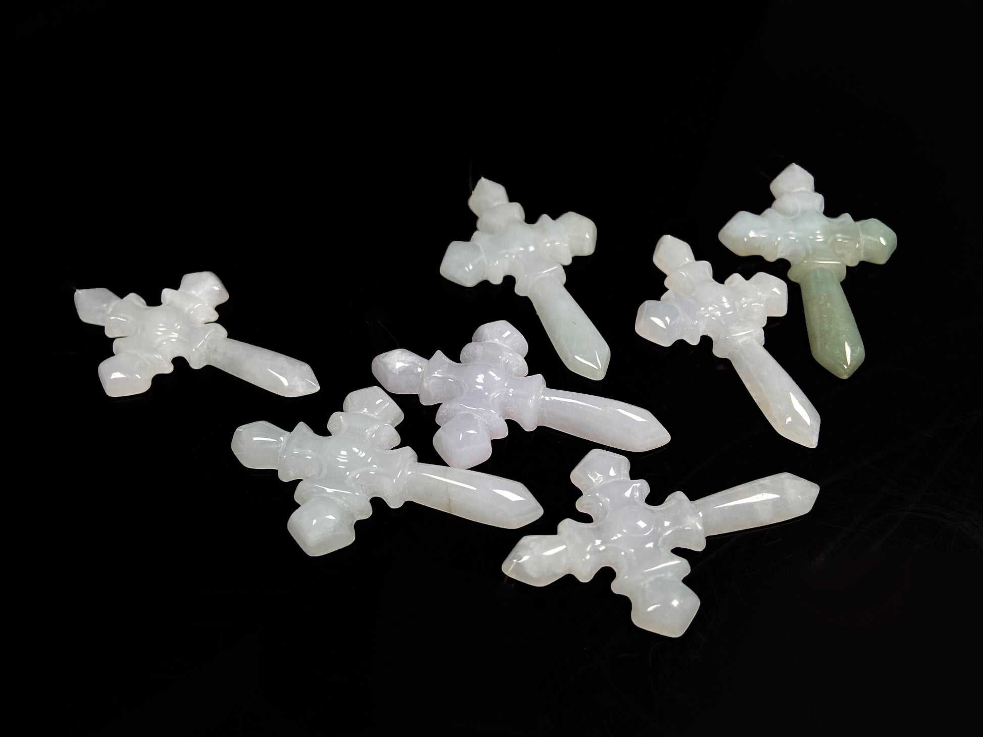 A milky white sword cross loose jadeite group.