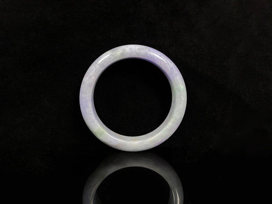 A pale lavender purple base with gentle green accents jadeite bangle.