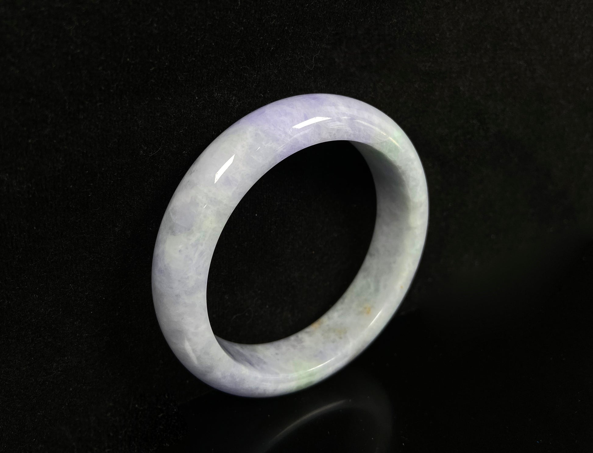 A pale lavender purple base with gentle green accents jadeite bangle.