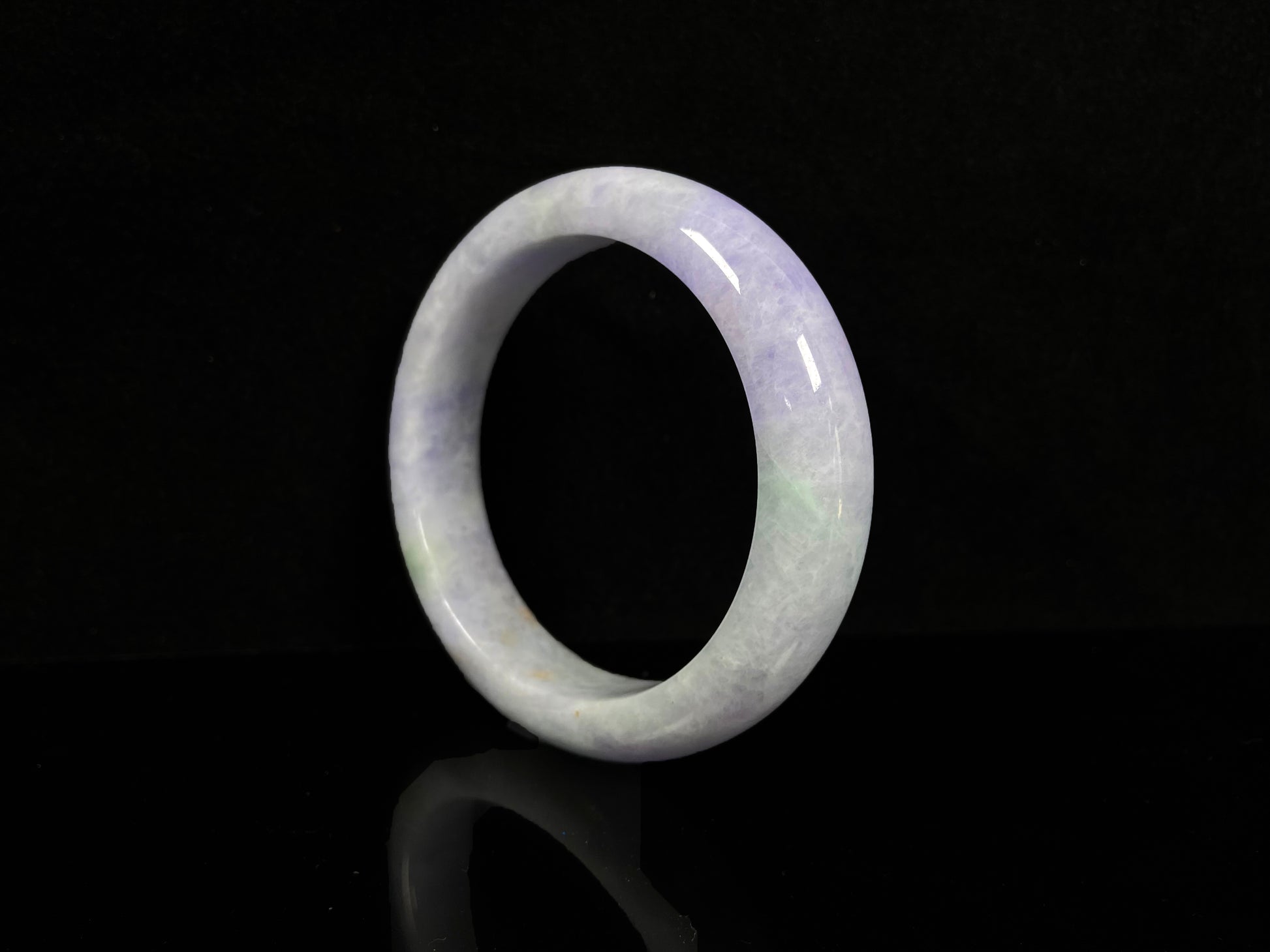 A pale lavender purple base with gentle green accents jadeite bangle.