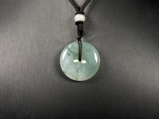 This is a loose jadeite disc in the classic “Ping An Kou” form, featuring a pale green tone throughout.