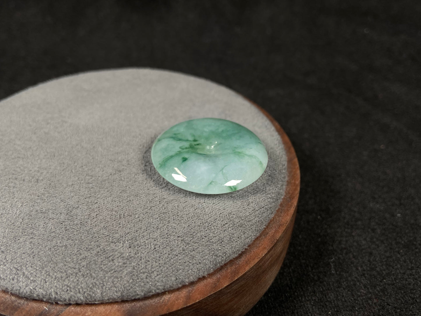This is a loose jadeite disc in the classic “Ping An Kou” form, featuring a pale green tone throughout.