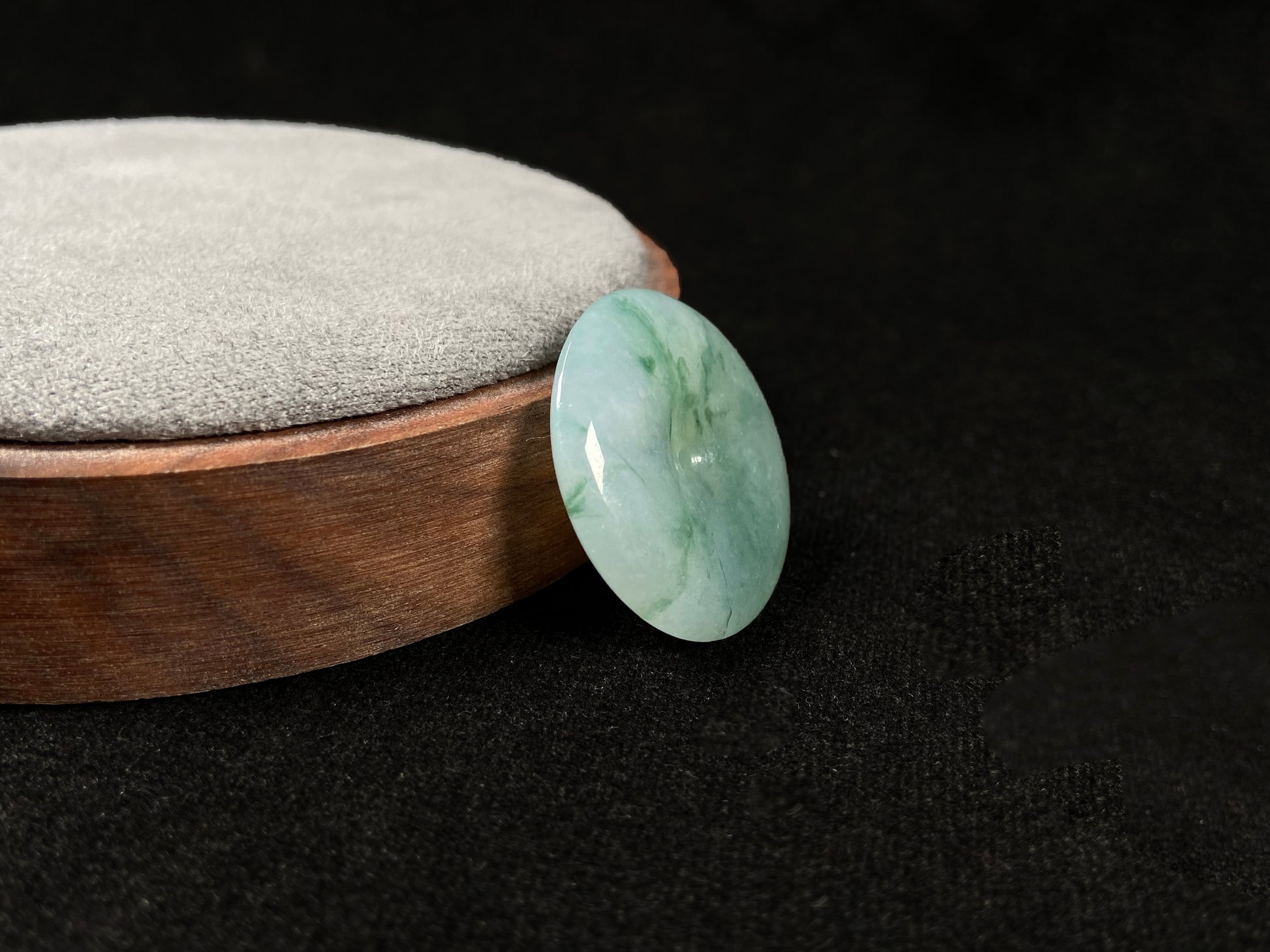 This is a loose jadeite disc in the classic “Ping An Kou” form, featuring a pale green tone throughout.