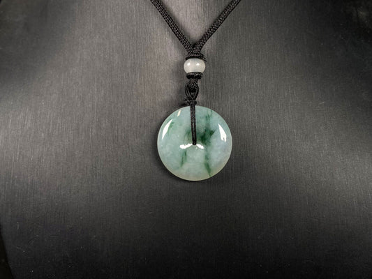 A icy green float round safety buckle jadeite pendant.