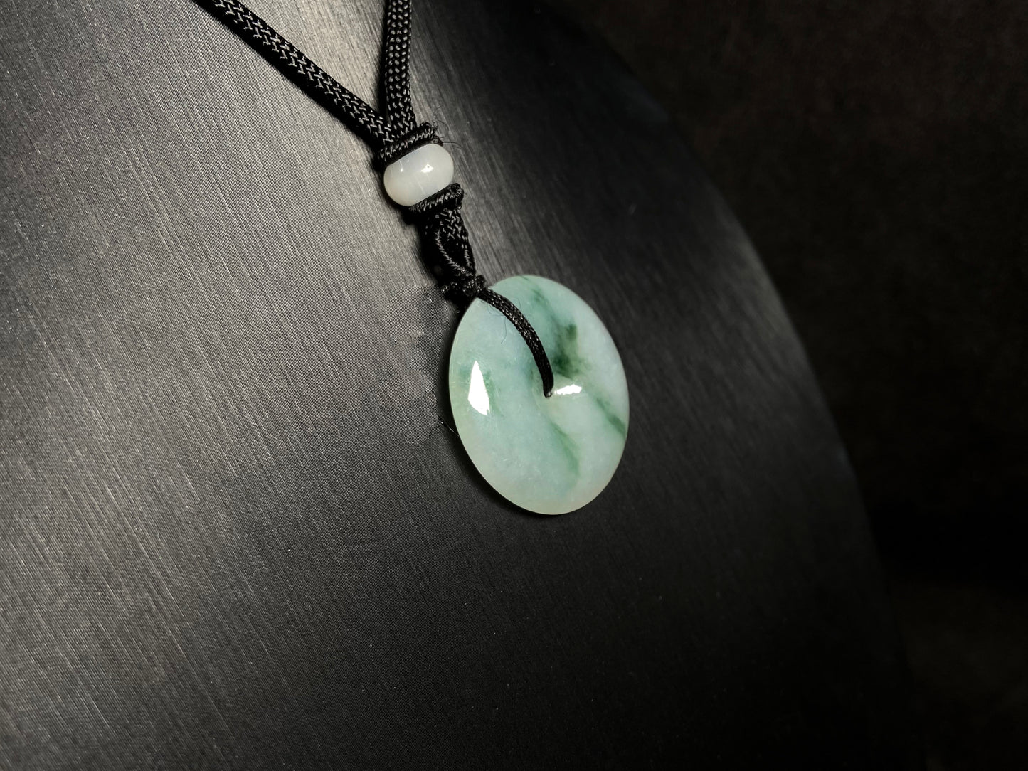A icy green float round safety buckle jadeite pendant.