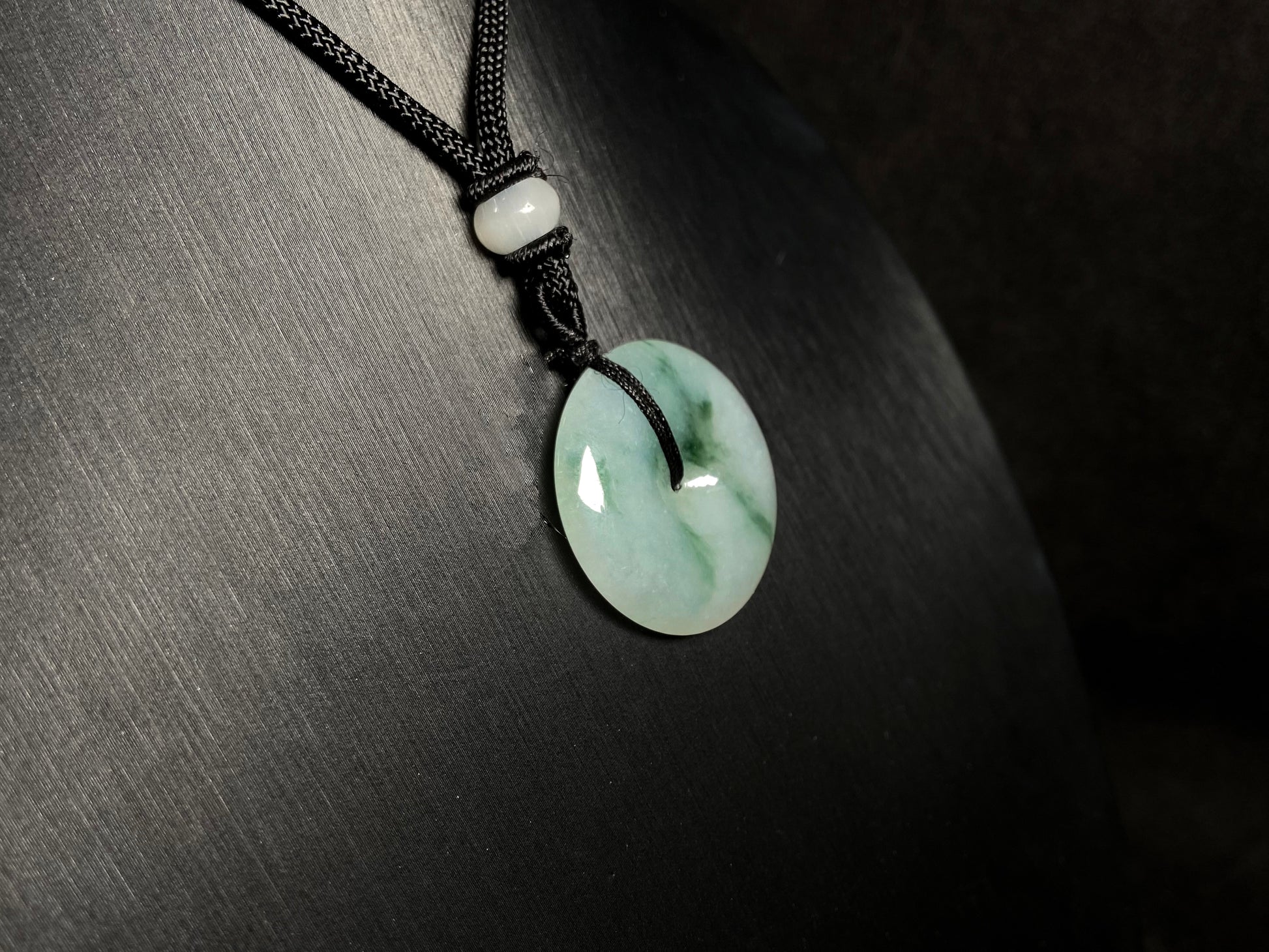A icy green float round safety buckle jadeite pendant.