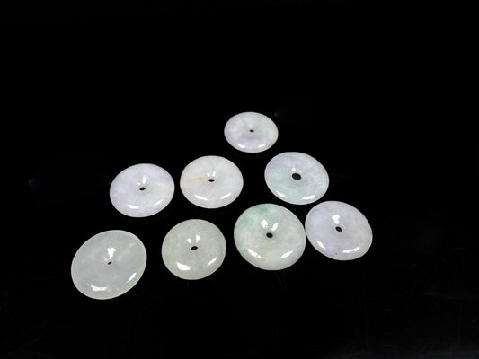 A white green Ping An Kou loose jadeite group.