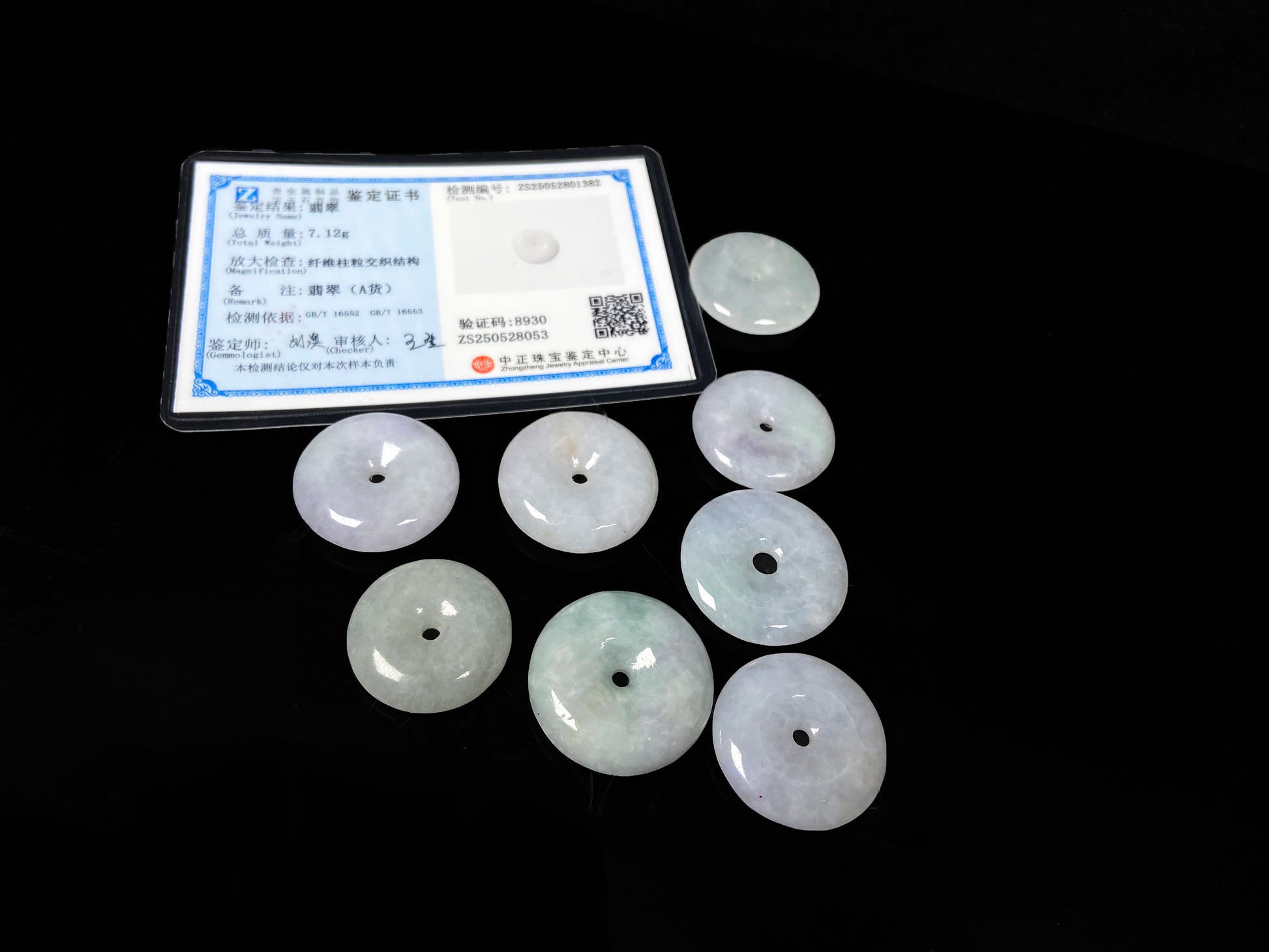 A white green Ping An Kou loose jadeite group.