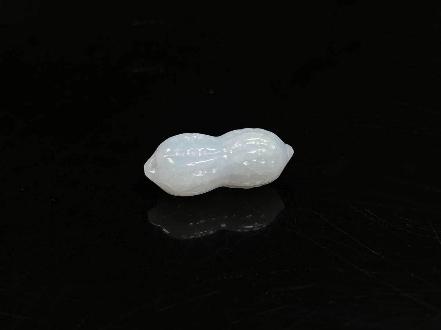 A luminous milky white peanut loose jadeite.