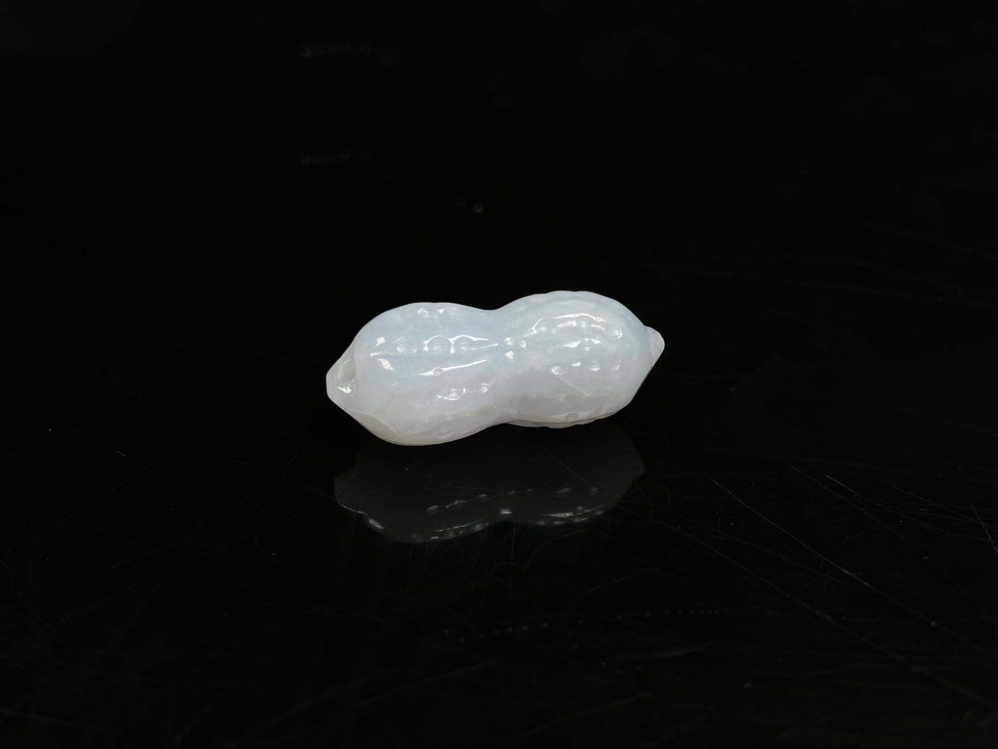A luminous milky white peanut loose jadeite.