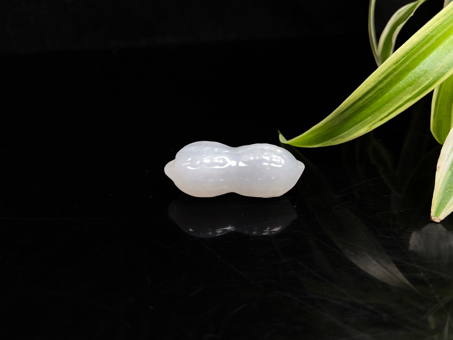 A luminous milky white peanut loose jadeite.