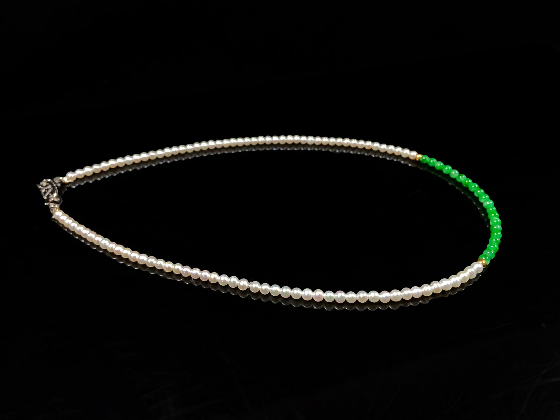 A soft pink freshwater pearl & vivid green jadeite beaded necklace.