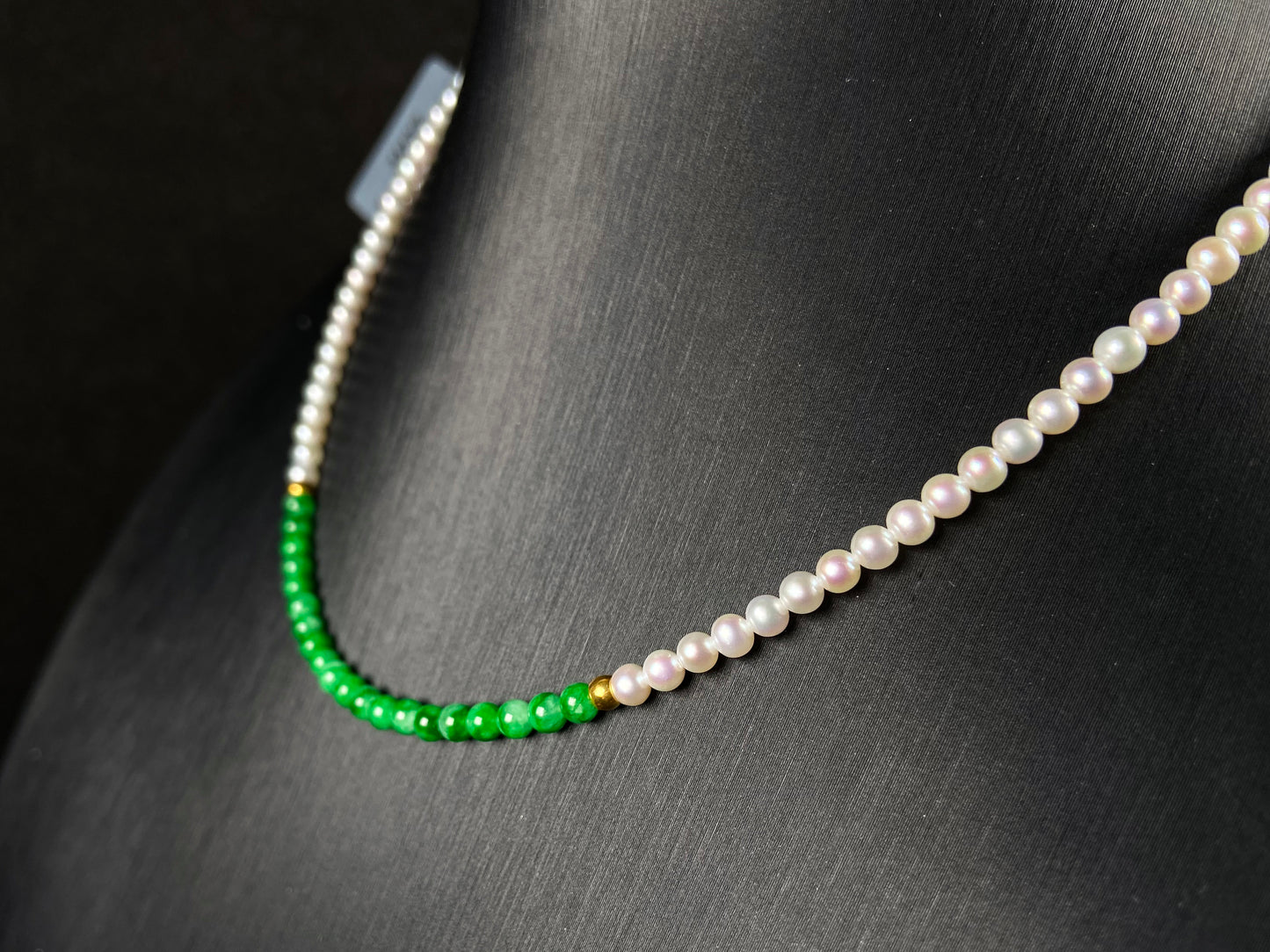 A soft pink freshwater pearl & vivid green jadeite beaded necklace.