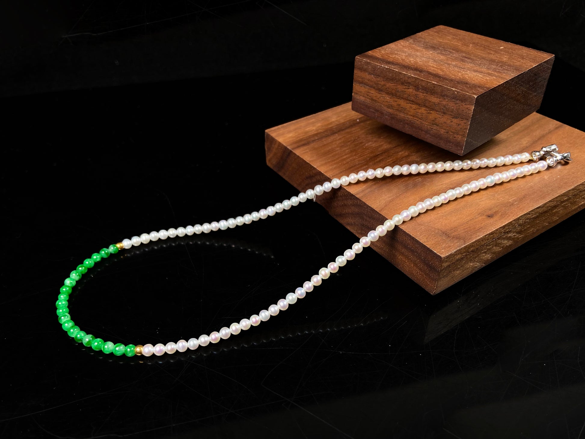 A soft pink freshwater pearl & vivid green jadeite beaded necklace.