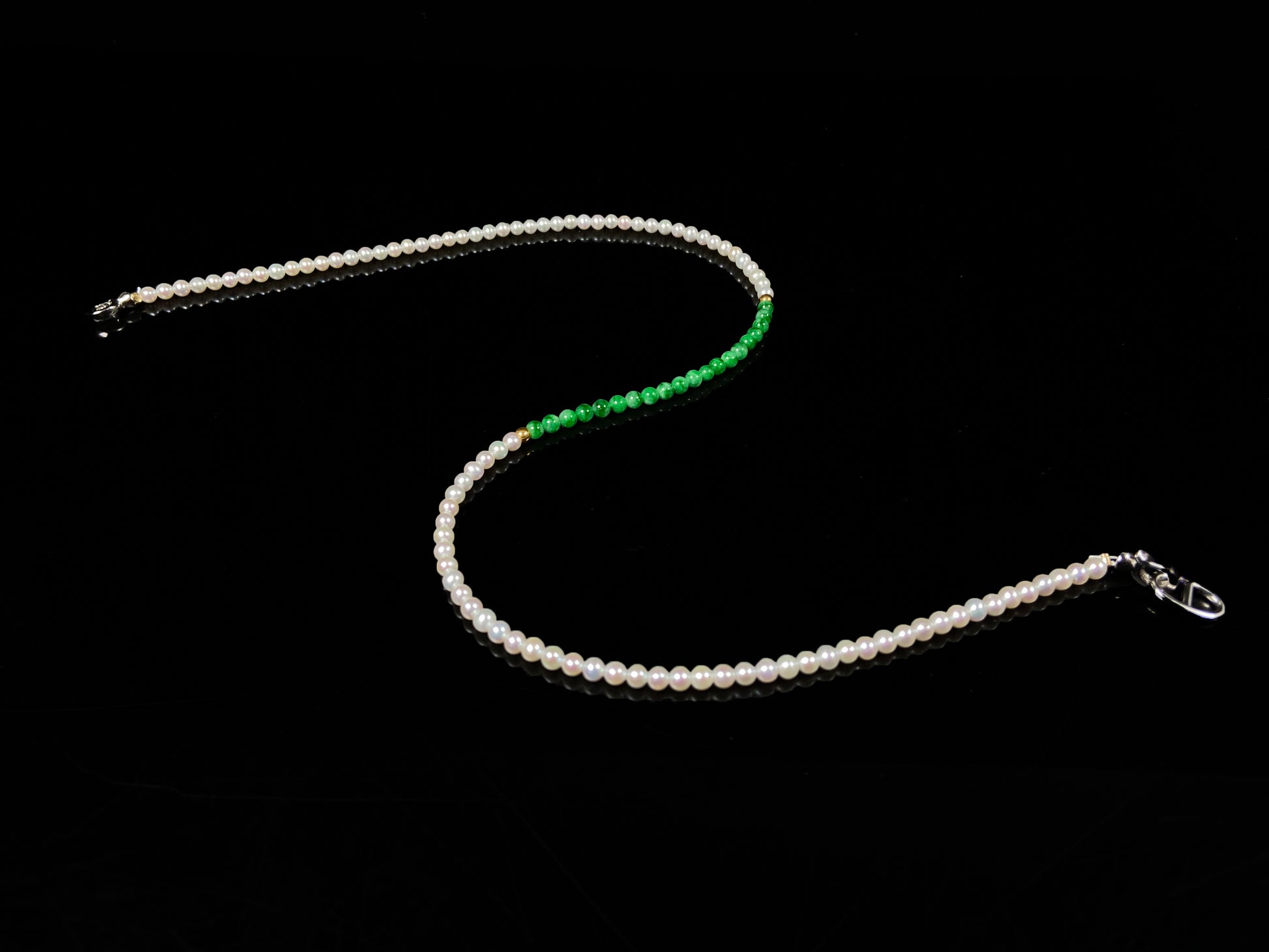 A soft pink freshwater pearl & vivid green jadeite beaded necklace.