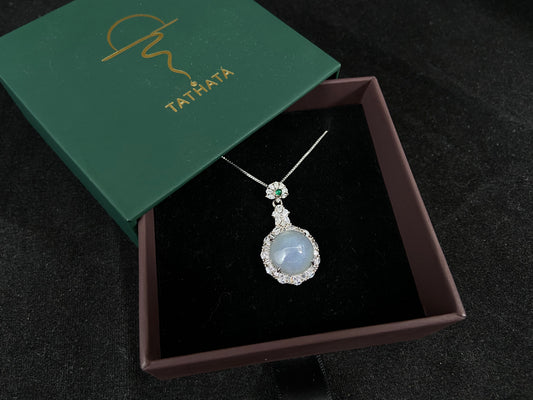A semi transparent, pale lavender jade bead is elegantly encircled by a 925 silver frame.