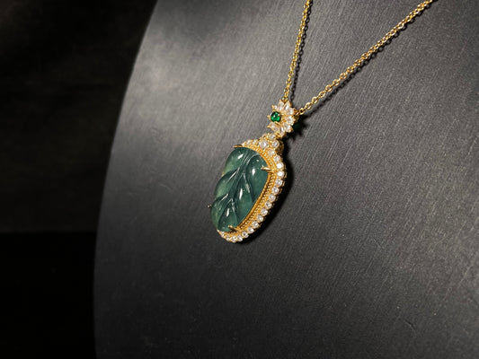 A deep aqua leaf vein jadeite pendant.
