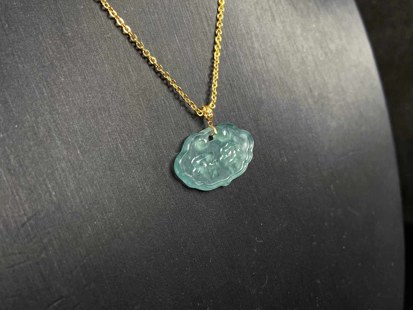 A floating flower icy blue jadeite pendant.