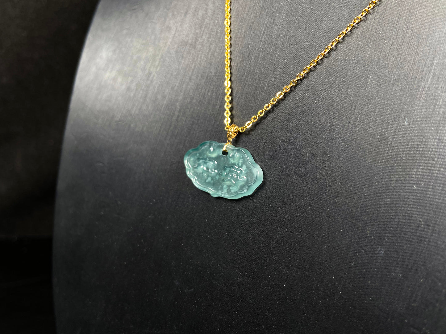 A floating flower icy blue jadeite pendant.