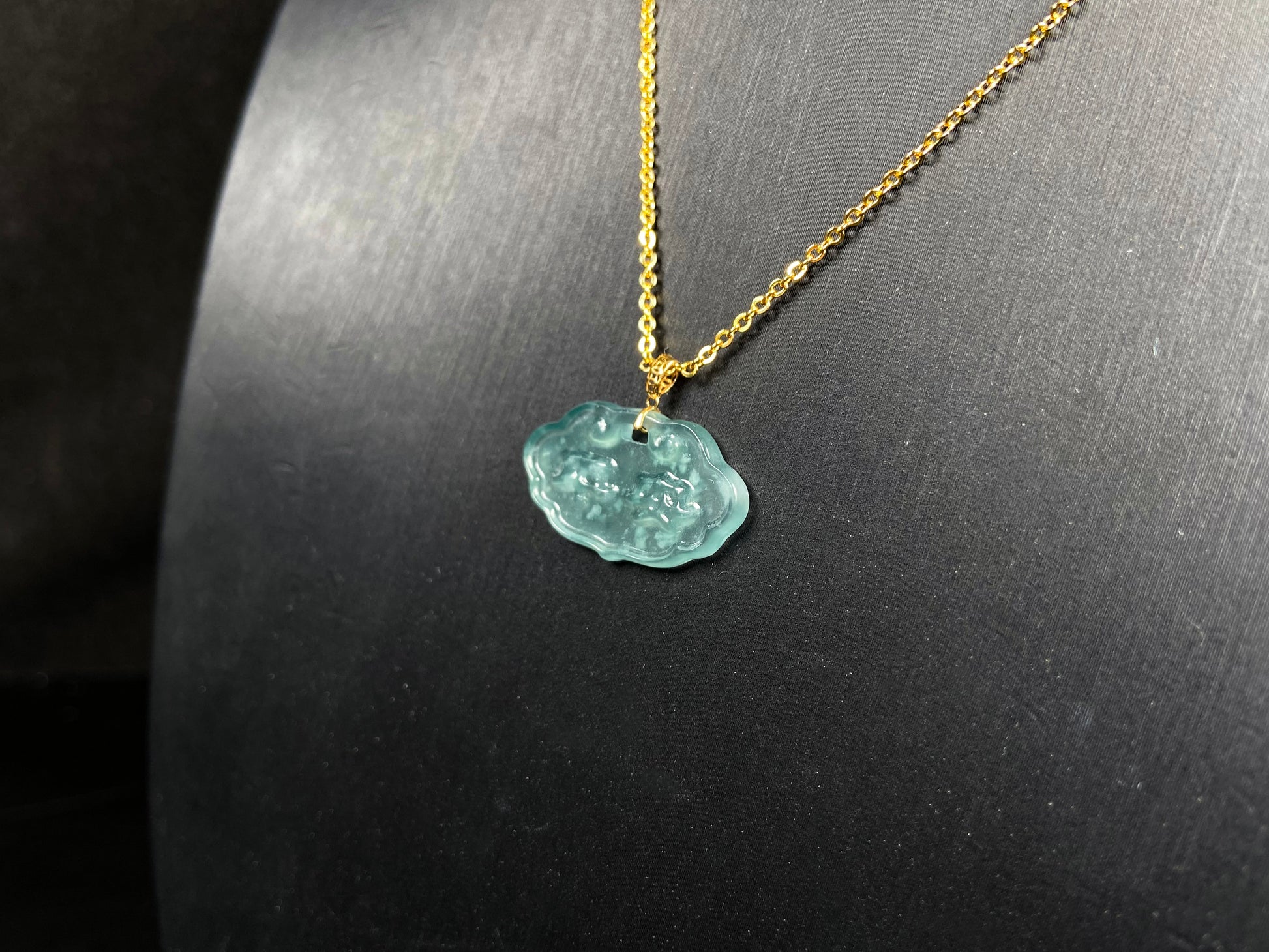 A floating flower icy blue jadeite pendant.