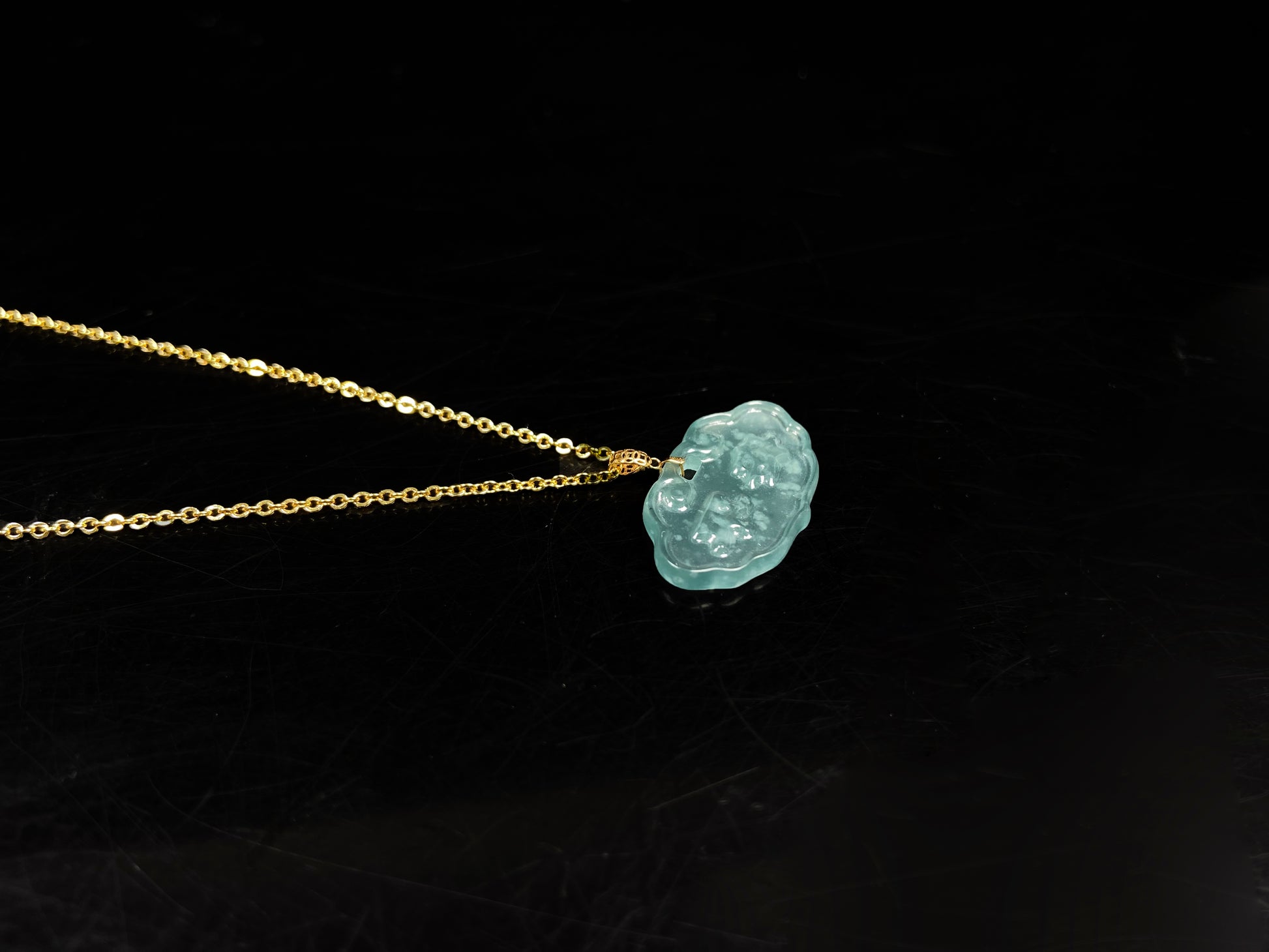 A floating flower icy blue jadeite pendant.