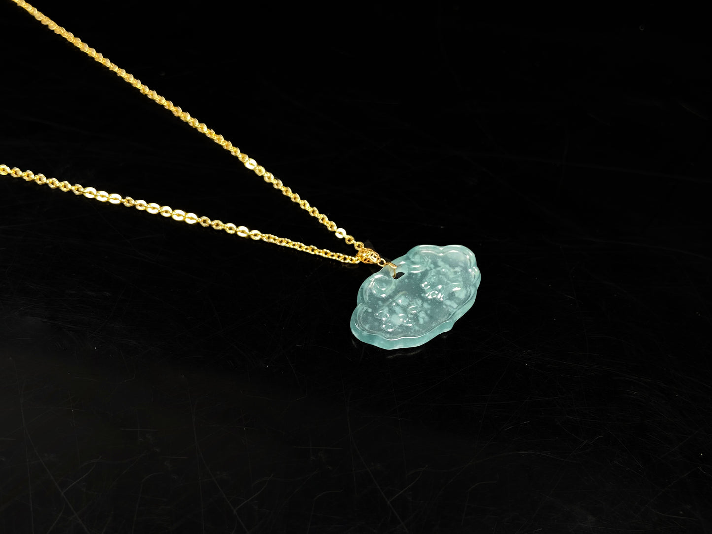 A floating flower icy blue jadeite pendant.