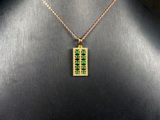 A full green square grid jadeite pendant.