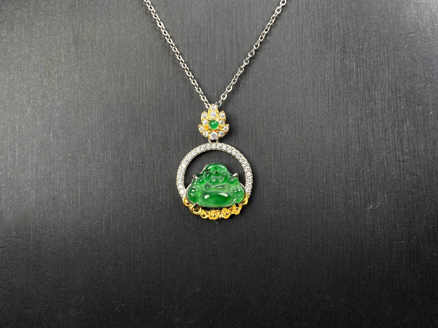 A lotus dual gold buddha jadeite pendant.