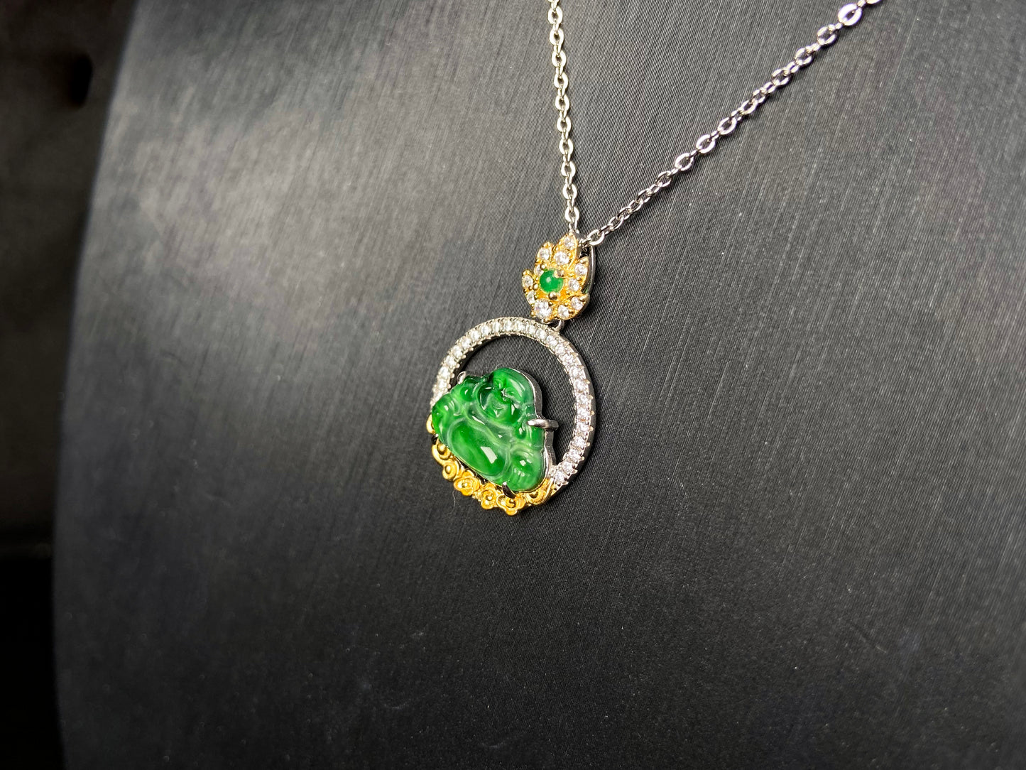 A lotus dual gold buddha jadeite pendant.