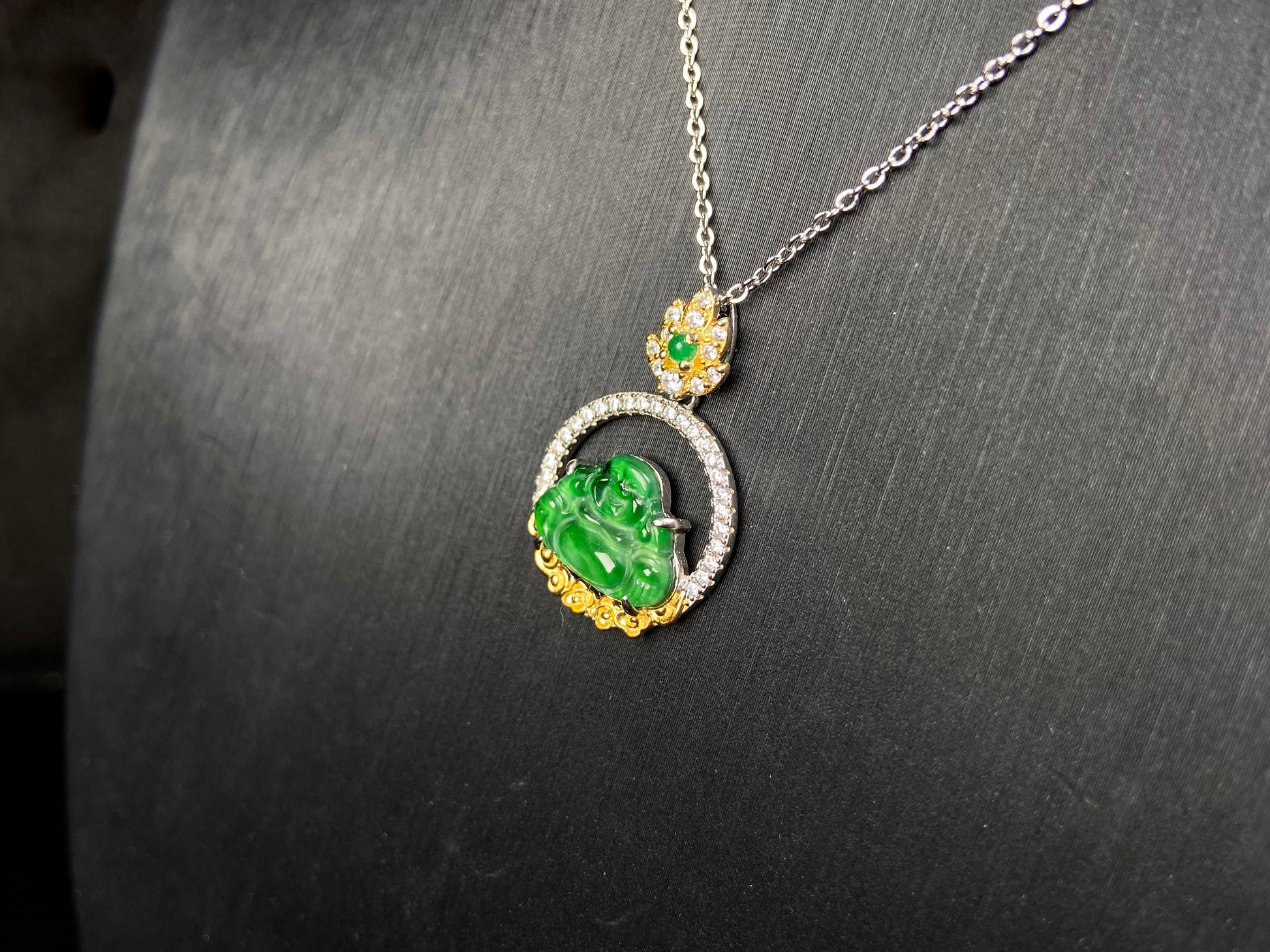 A lotus dual gold buddha jadeite pendant.