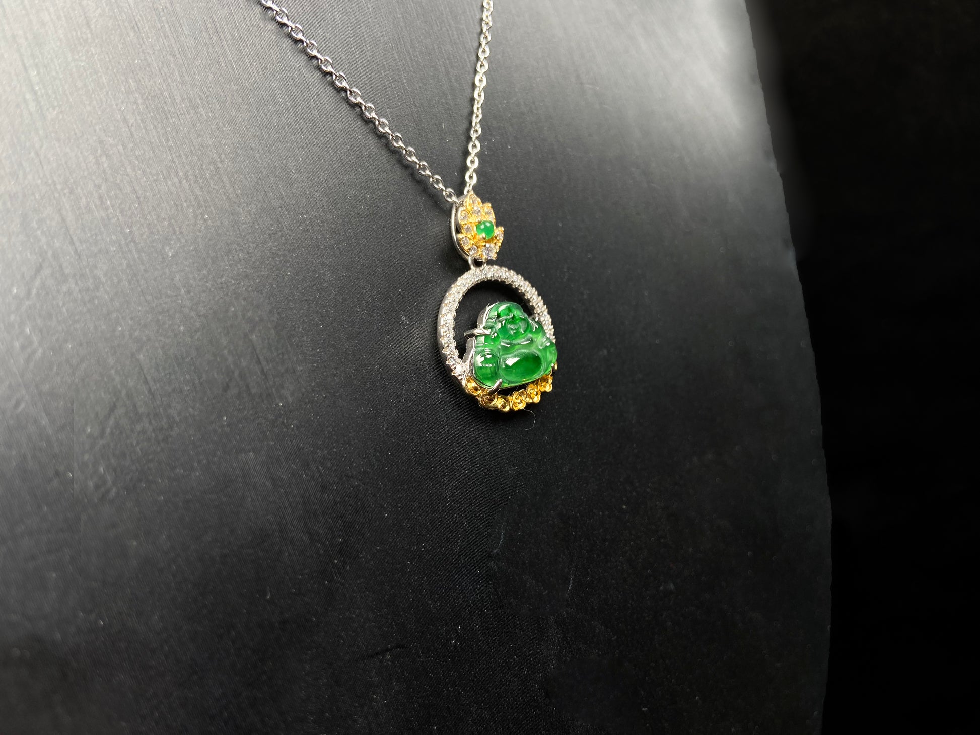A lotus dual gold buddha jadeite pendant.