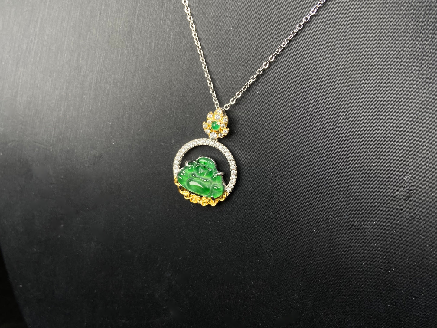 A lotus dual gold buddha jadeite pendant.