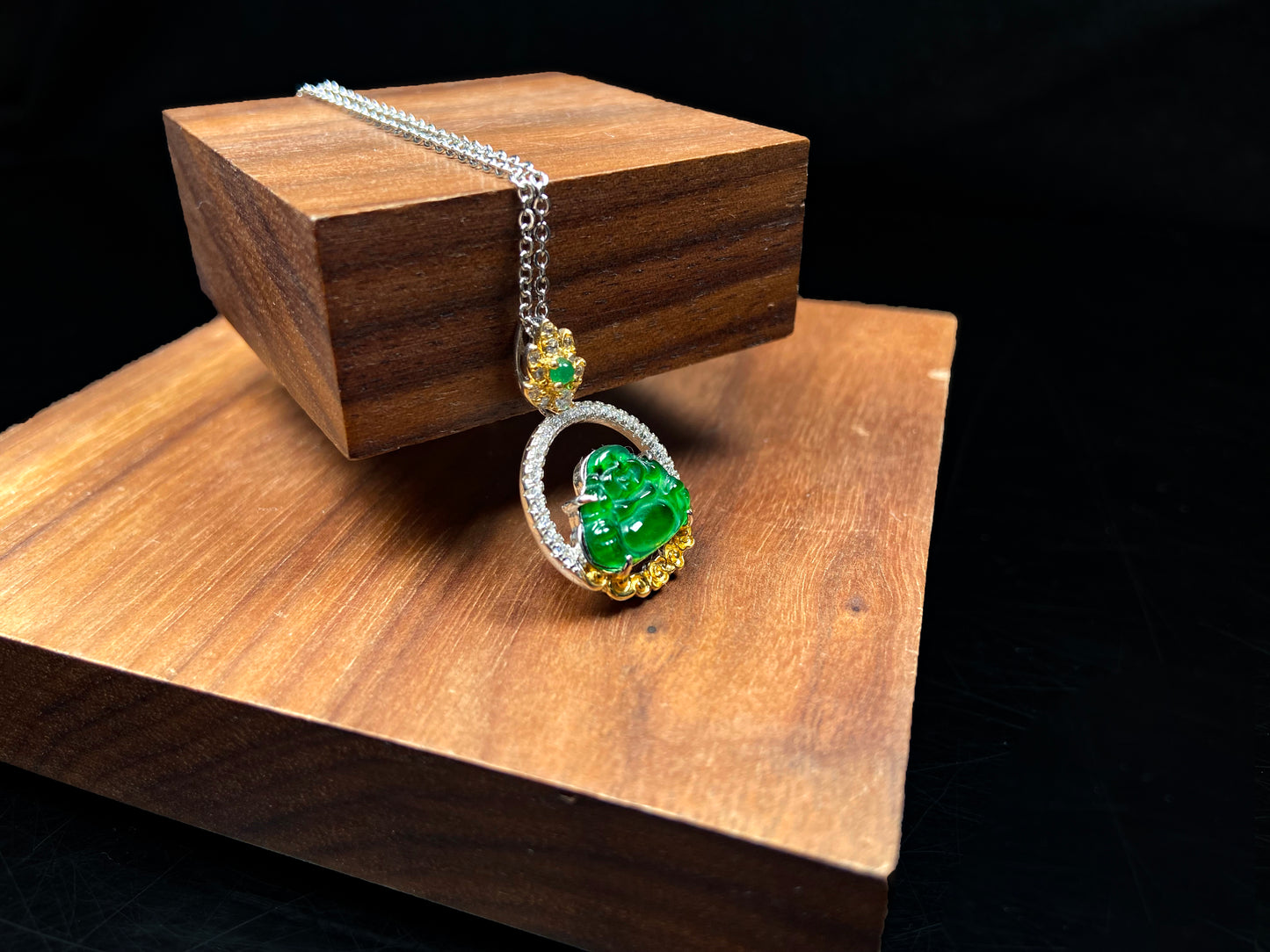 A lotus dual gold buddha jadeite pendant.